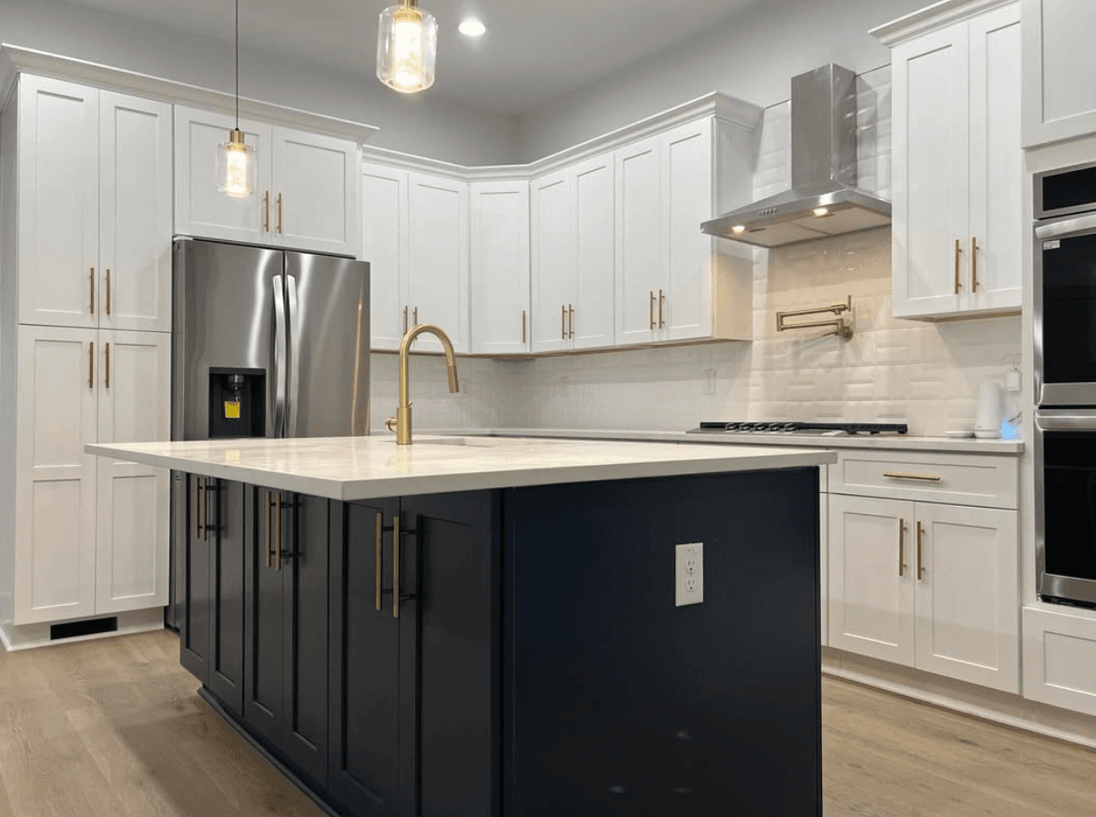 Kennesaw, GA · Bright white kitchen with marble-look quartz and apron sink.