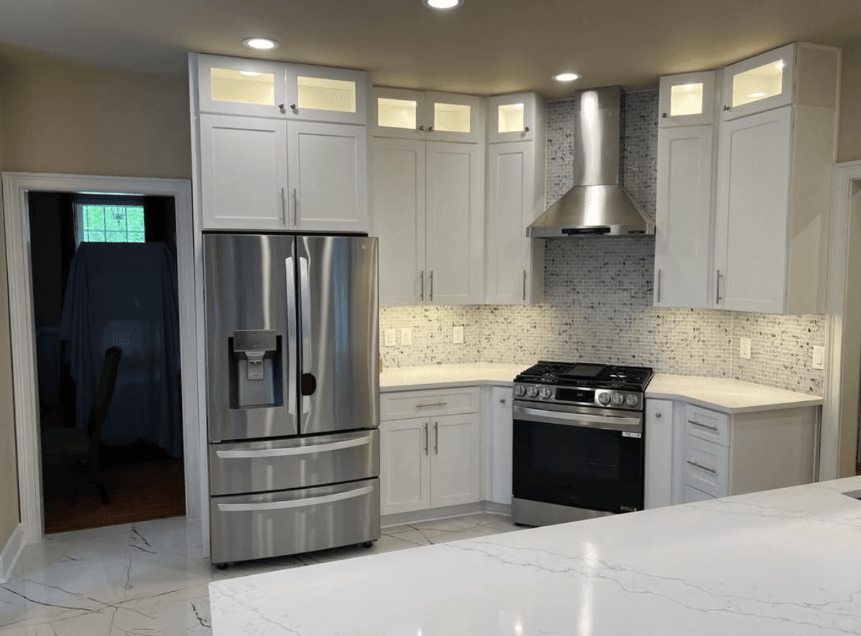 Decatur, GA · Glass-front upper cabinets with marble-look porcelain floor.