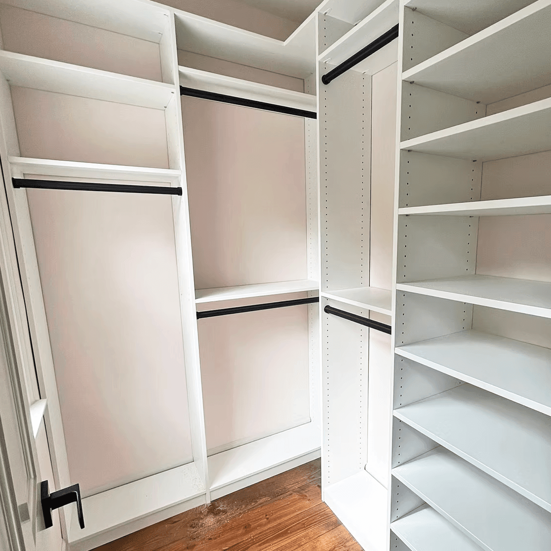 Johns Creek, GA · White walk-in system with adjustable shelves and double-hang rods.