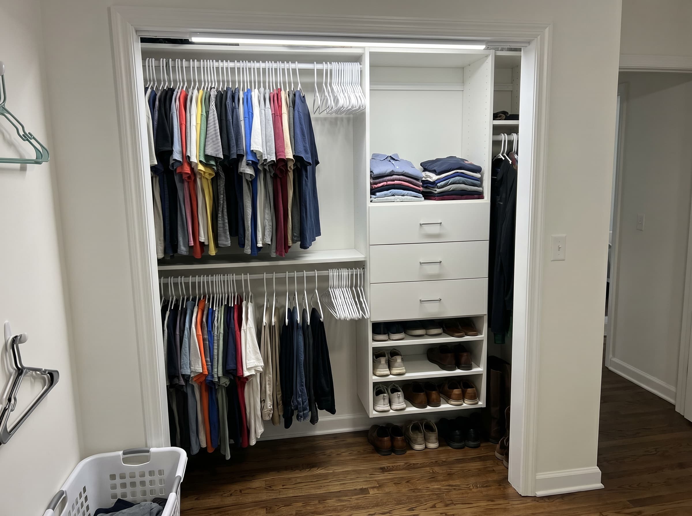 Duluth, GA · Bedroom reach-in with double-hang, drawer bank, and shoe shelves.