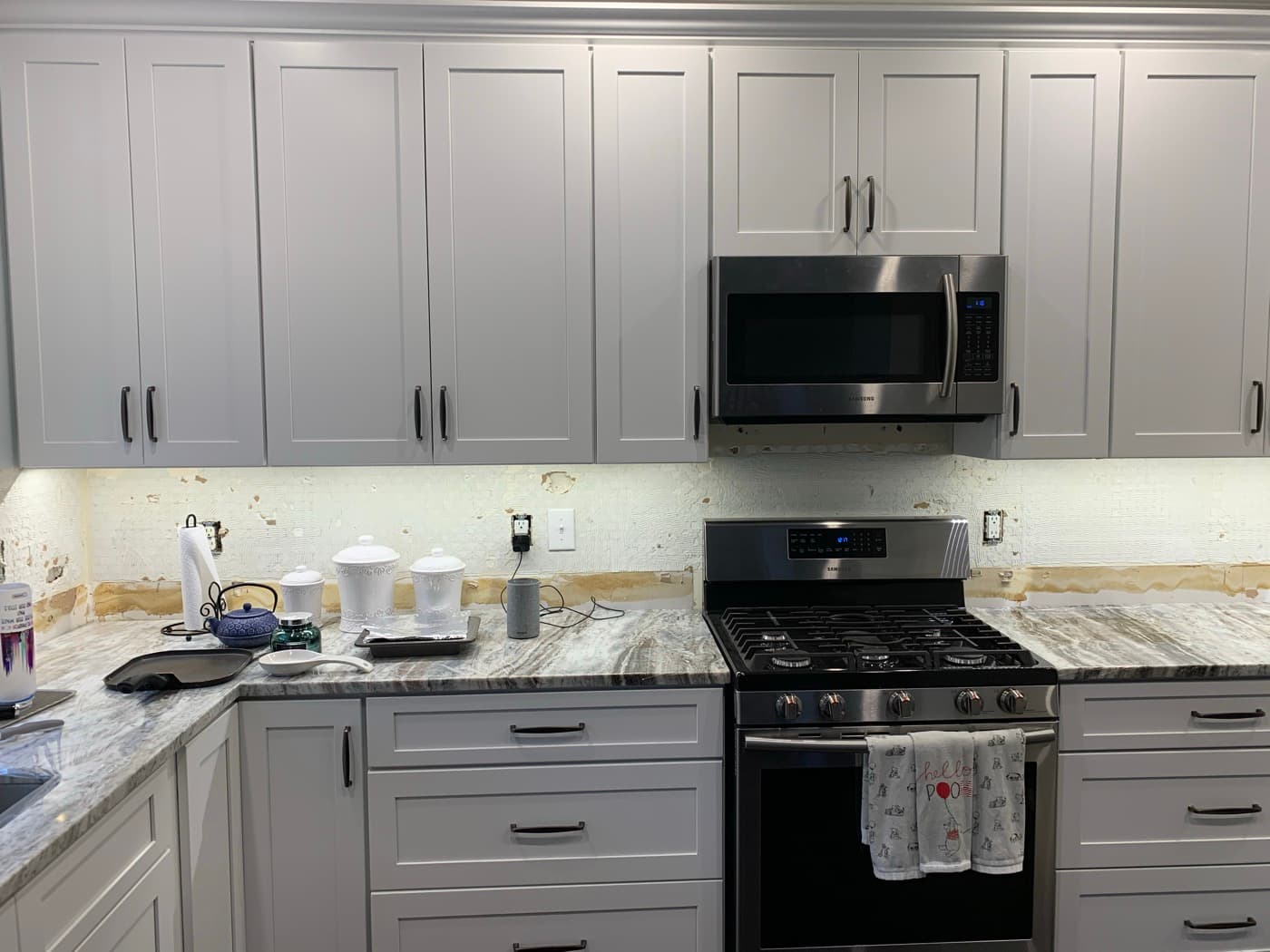 Roswell, GA · Custom kitchen with full-height uppers and stained island.