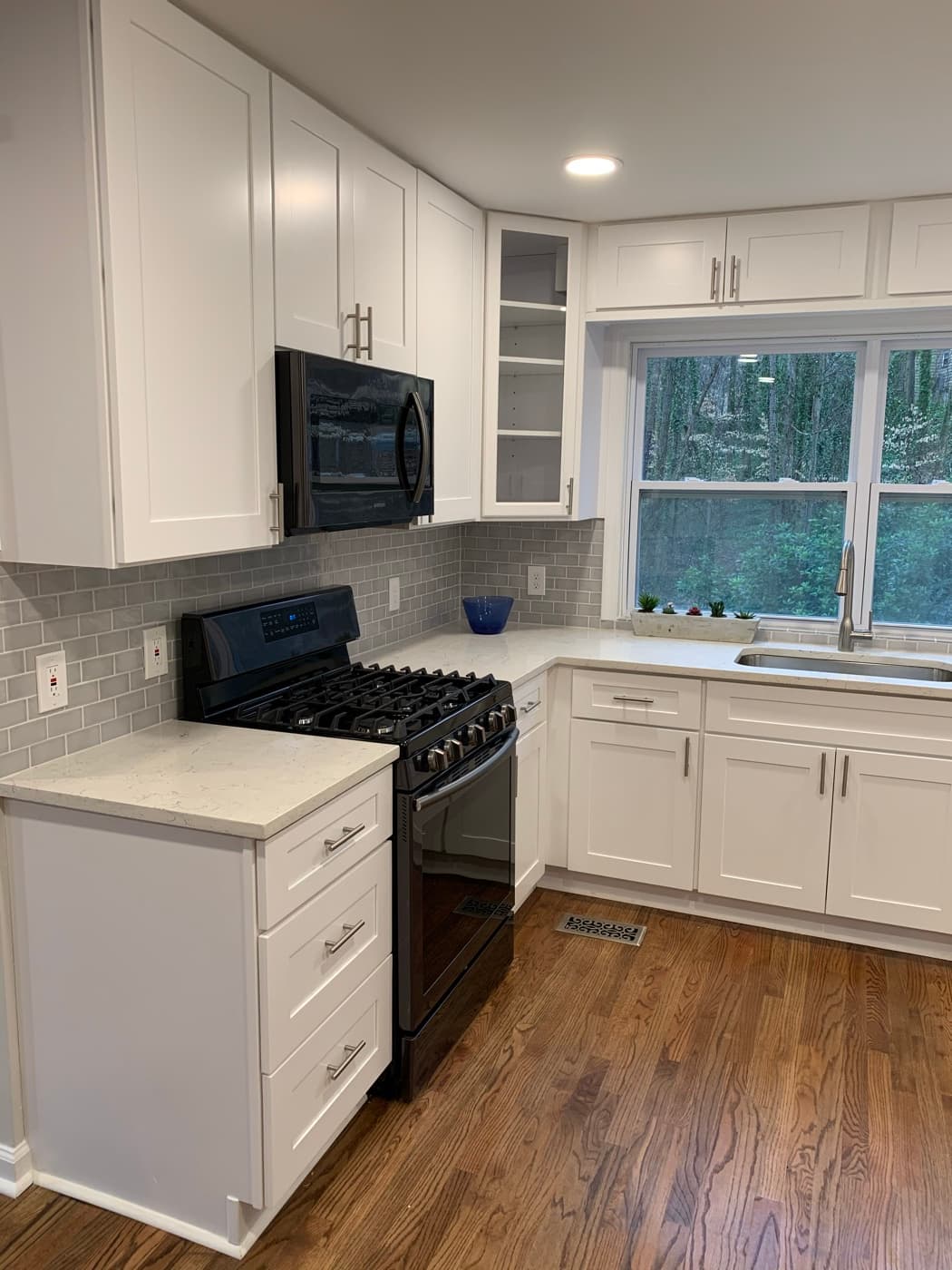 Cumming, GA · Open-concept kitchen with bar-height island seating.