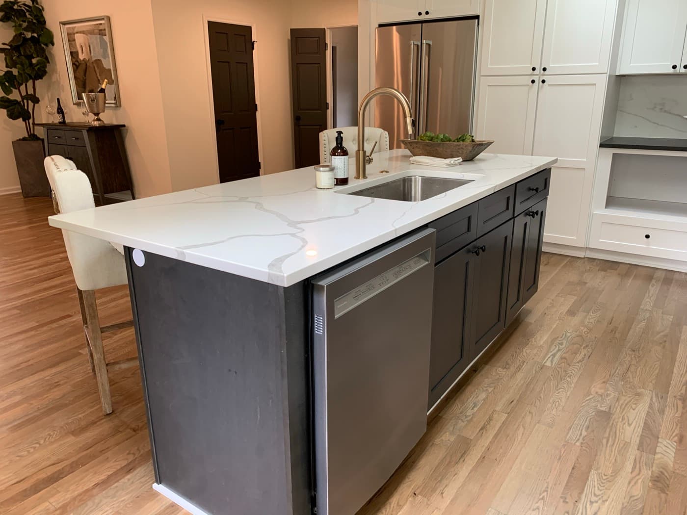 Suwanee, GA · White shaker kitchen with quartz counters and island.