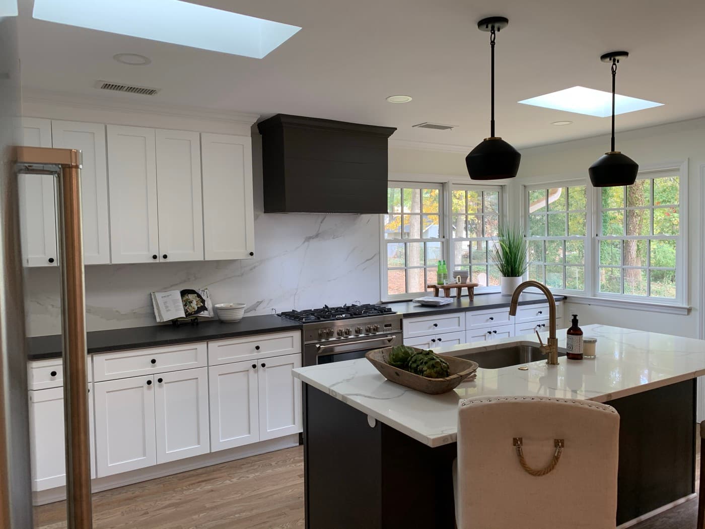 Kennesaw, GA · Two-tone kitchen with painted island and brass hardware.
