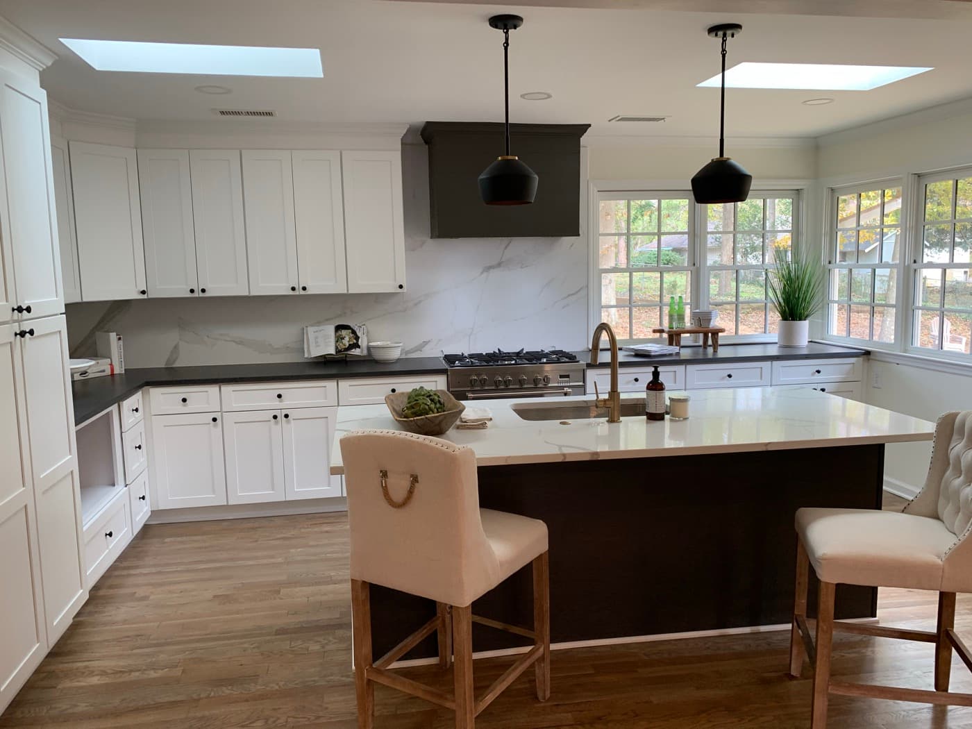 Woodstock, GA · Custom kitchen with full-height uppers and stained island.