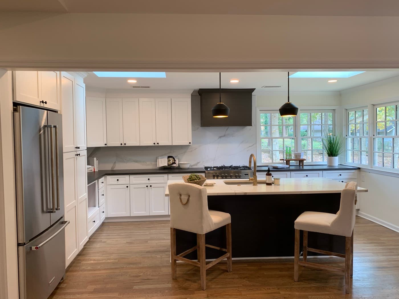 Sandy Springs, GA · White kitchen with subway backsplash and stainless appliances.