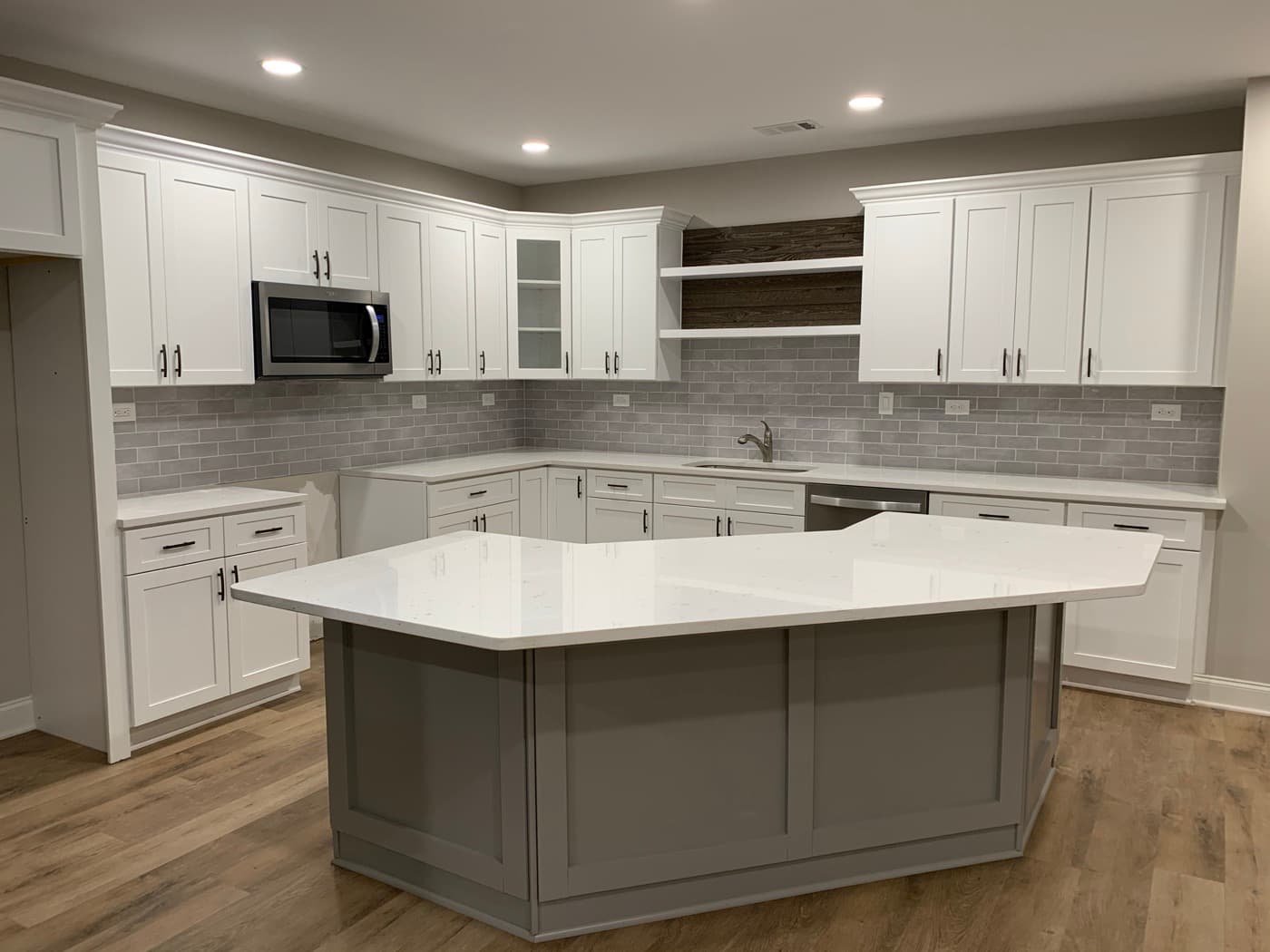 Smyrna, GA · White shaker kitchen with quartz counters and island.
