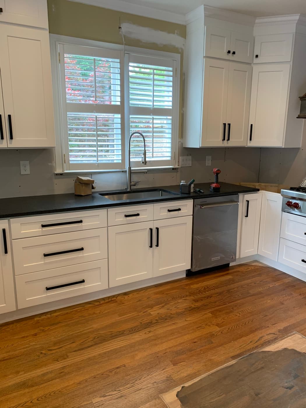 Canton, GA · Floor-to-ceiling pantry with adjustable shelving and roll-outs.