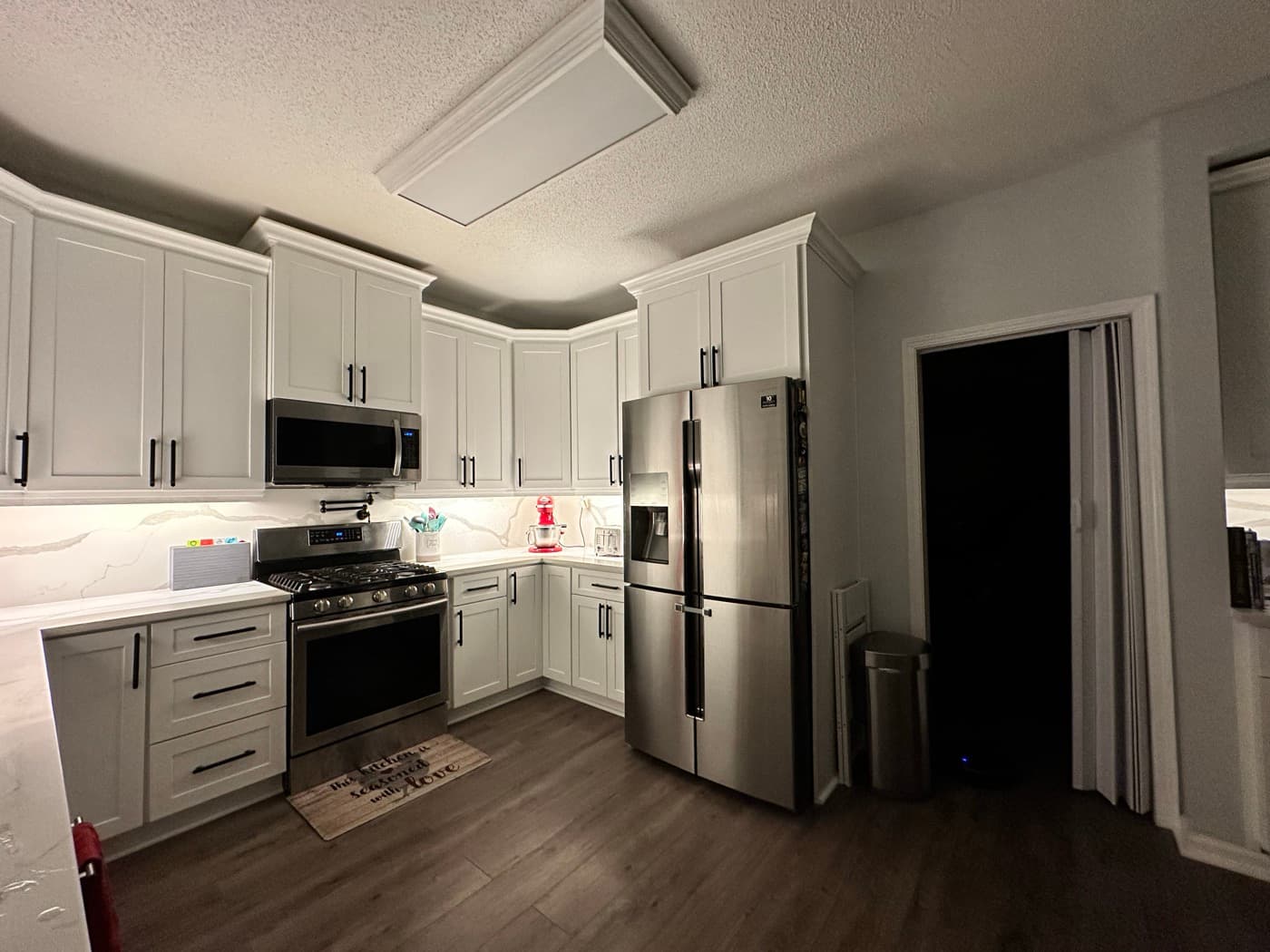 Peachtree Corners, GA · White kitchen with subway backsplash and stainless appliances.