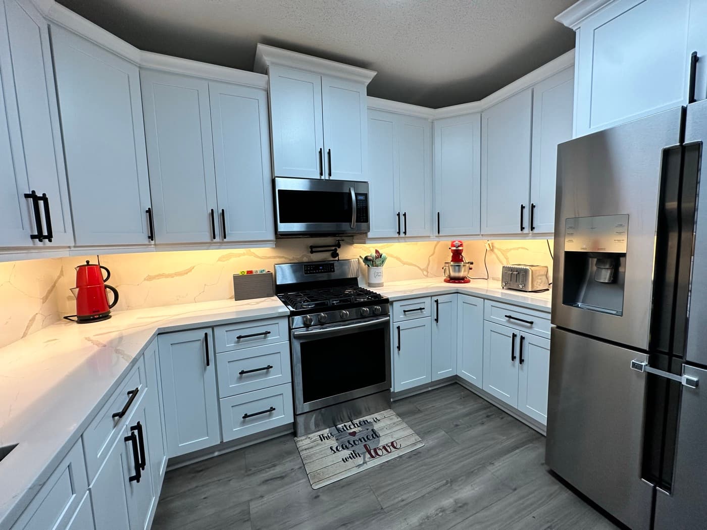Lawrenceville, GA · Open-concept kitchen with bar-height island seating.