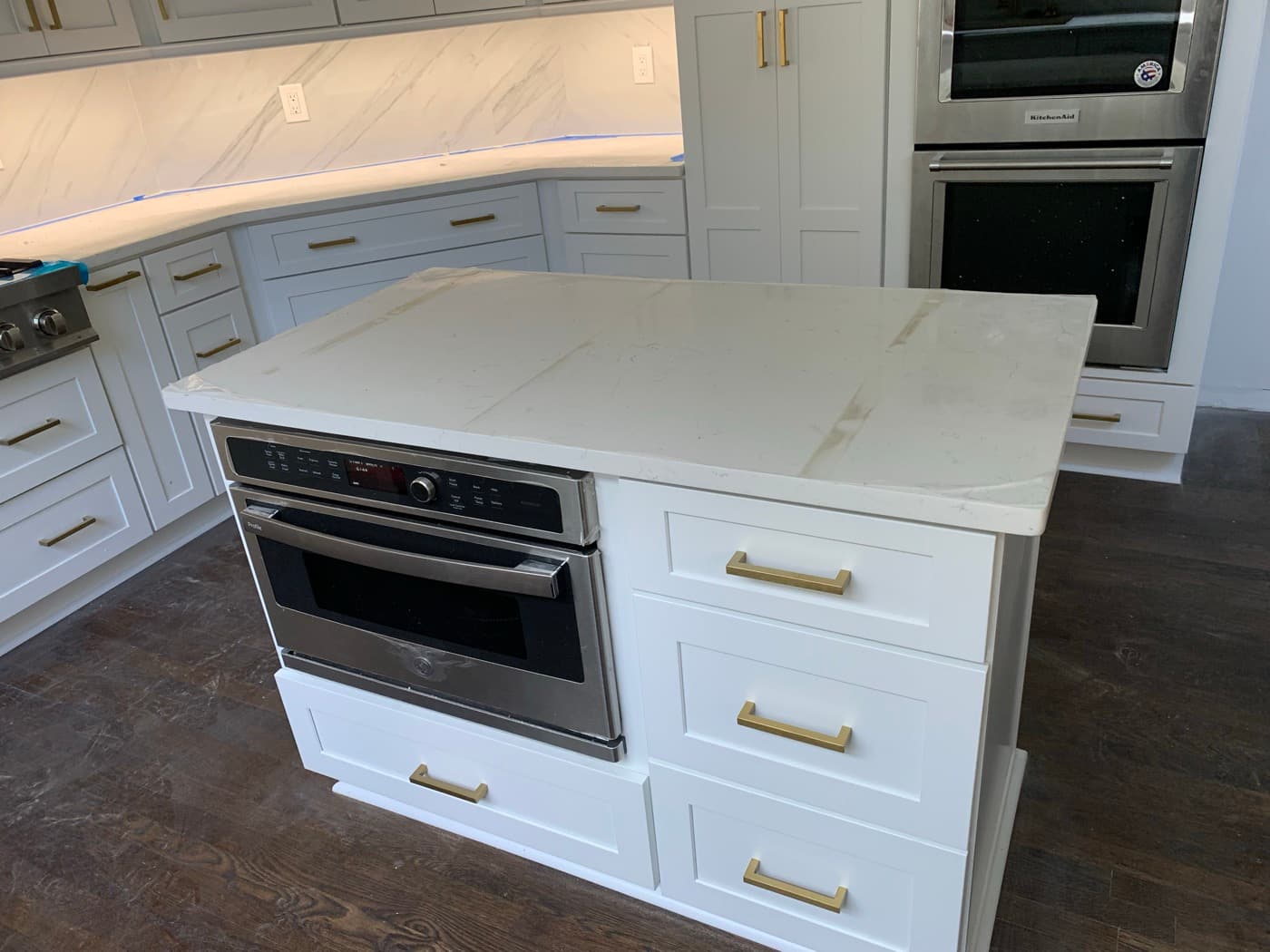 Alpharetta, GA · Custom kitchen with full-height uppers and stained island.