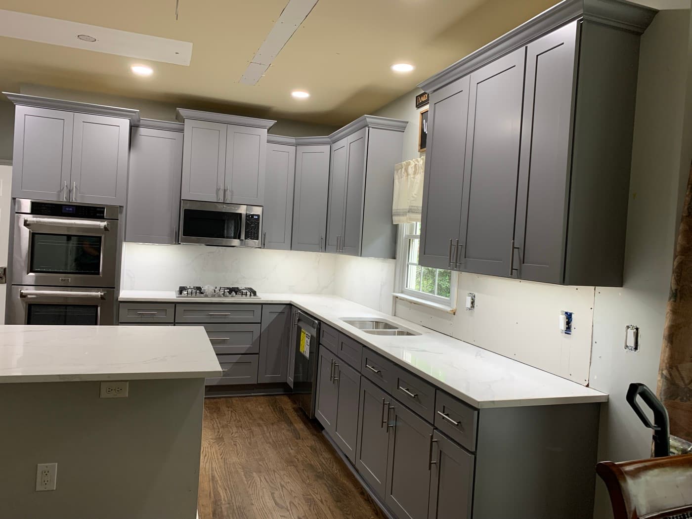 Roswell, GA · Open-concept kitchen with bar-height island seating.