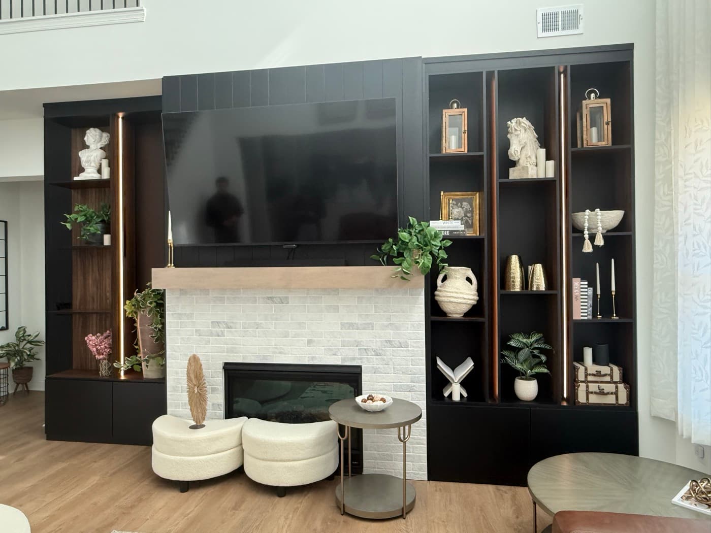 Cumming, GA · Custom built-in media wall with floating shelves.