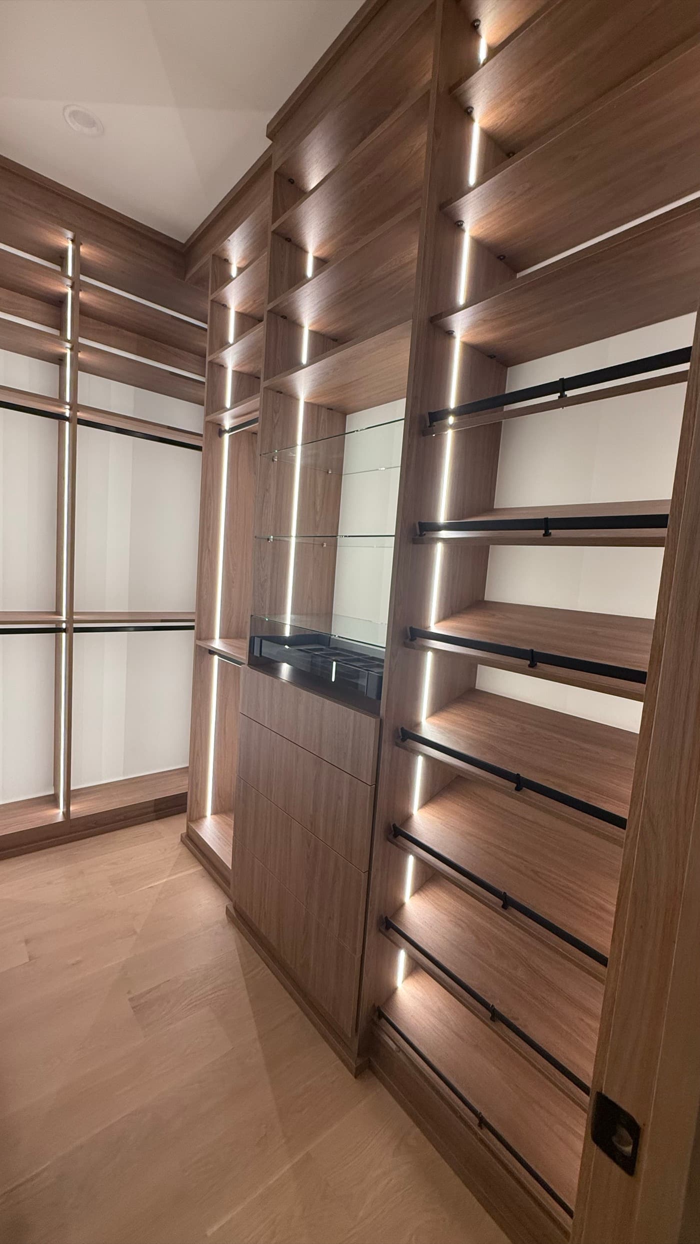 Woodstock, GA · Custom walk-in with LED-lit wood shelving and island.
