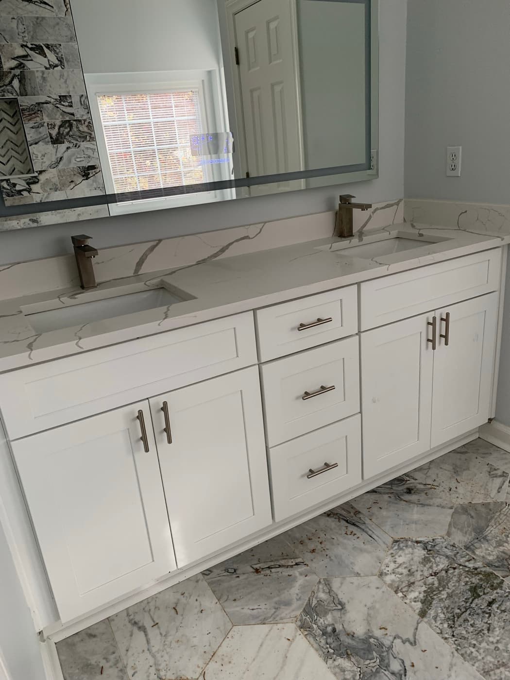 Lawrenceville, GA · Custom bathroom vanity with quartz top.