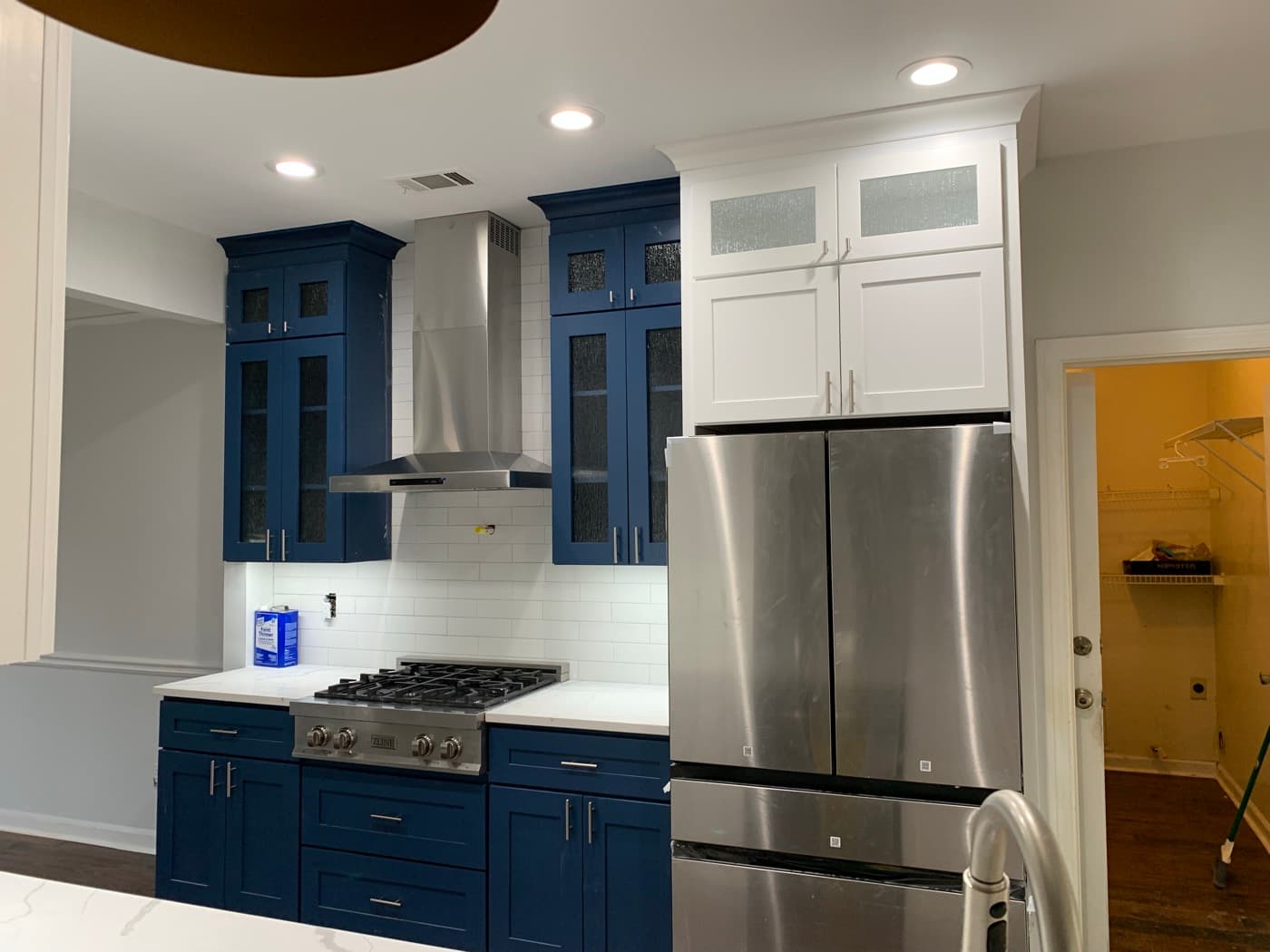 Buford, GA · Two-tone kitchen with painted island and brass hardware.