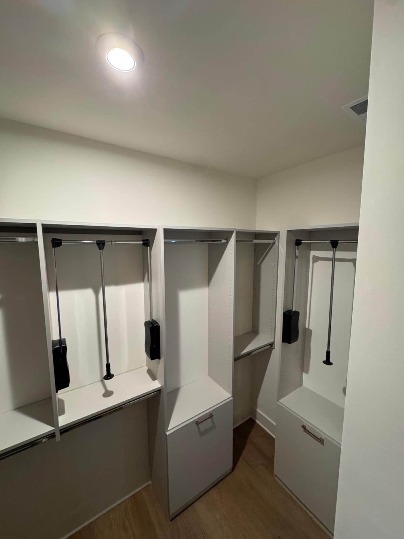 Dunwoody, GA · Walk-in closet with double-hang, drawers, and shoe shelves.