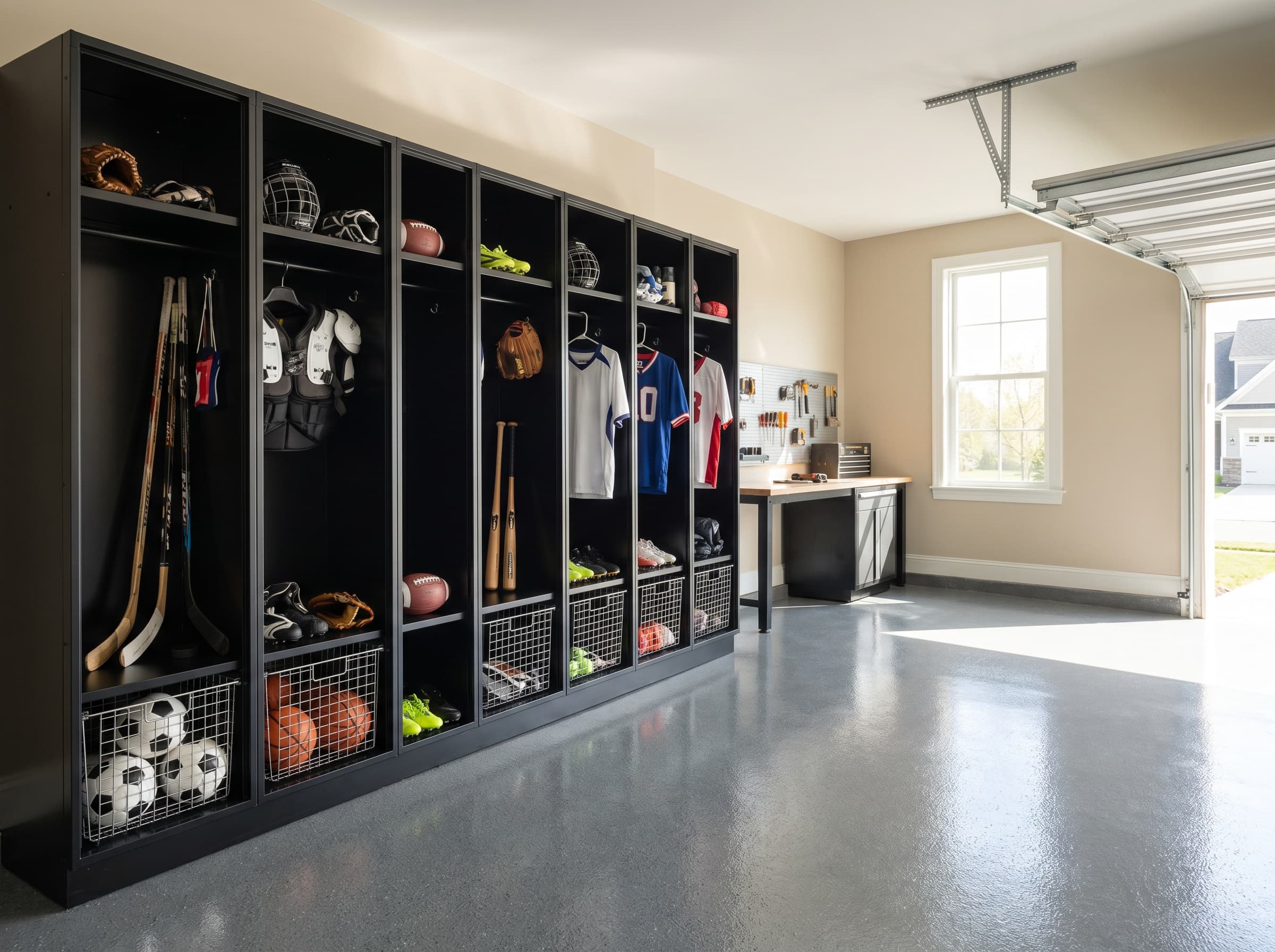Dunwoody, GA · Matte black sports lockers with mesh baskets and jersey hooks.