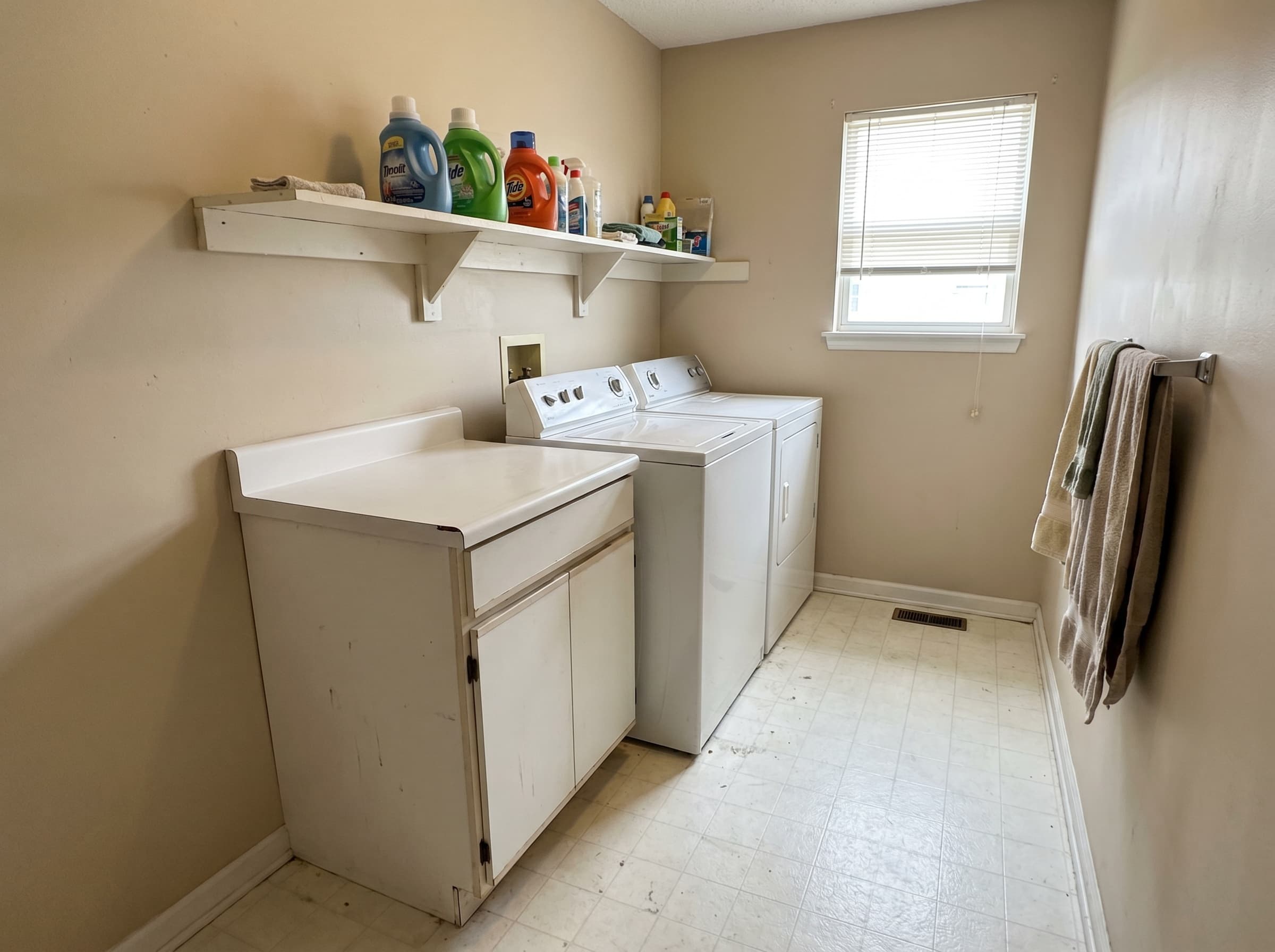 Buford, GA · Budget laundry with single base cabinet and open shelf.