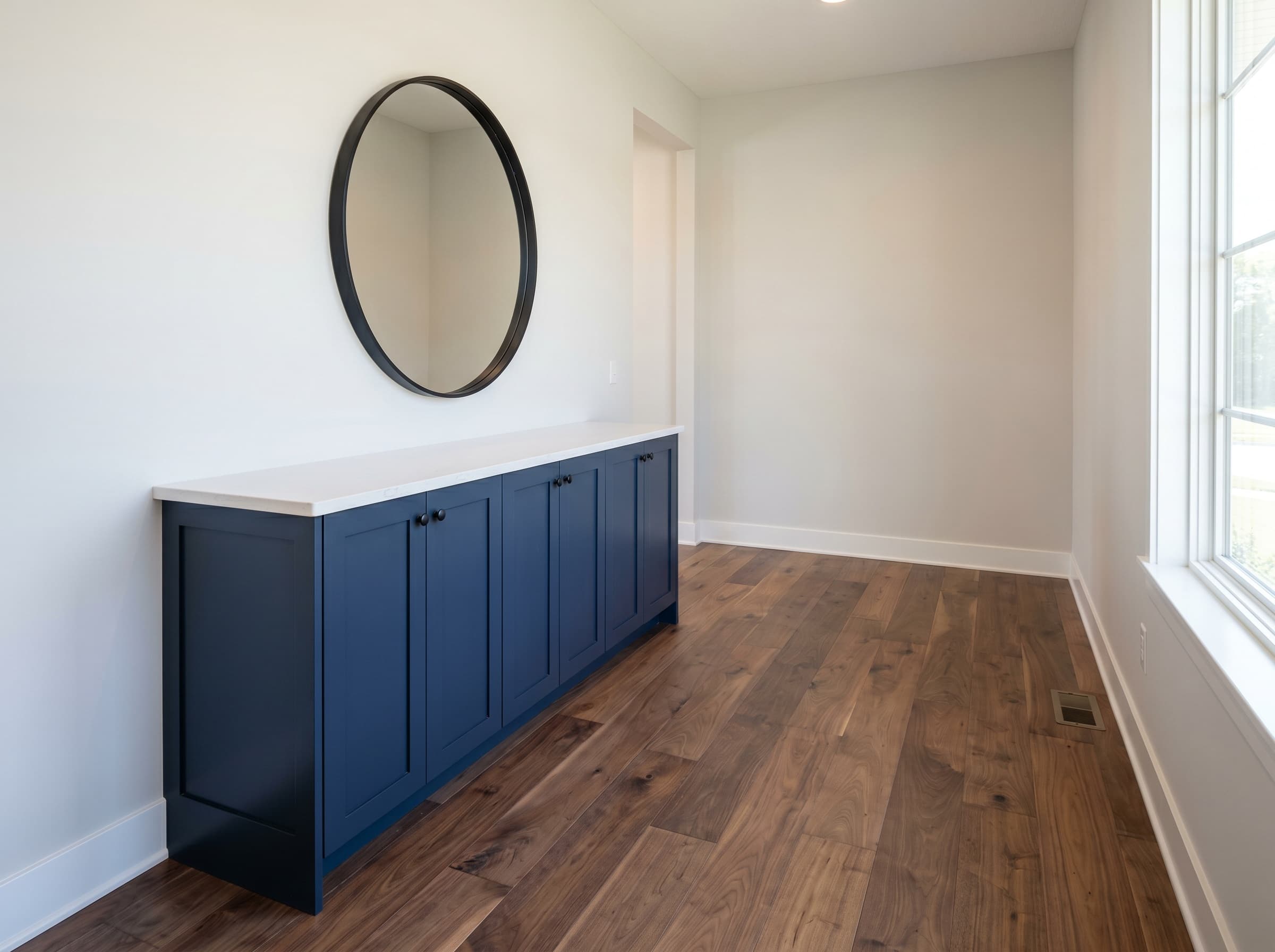 Alpharetta, GA · Built-in navy shaker front-entry console with quartz top.