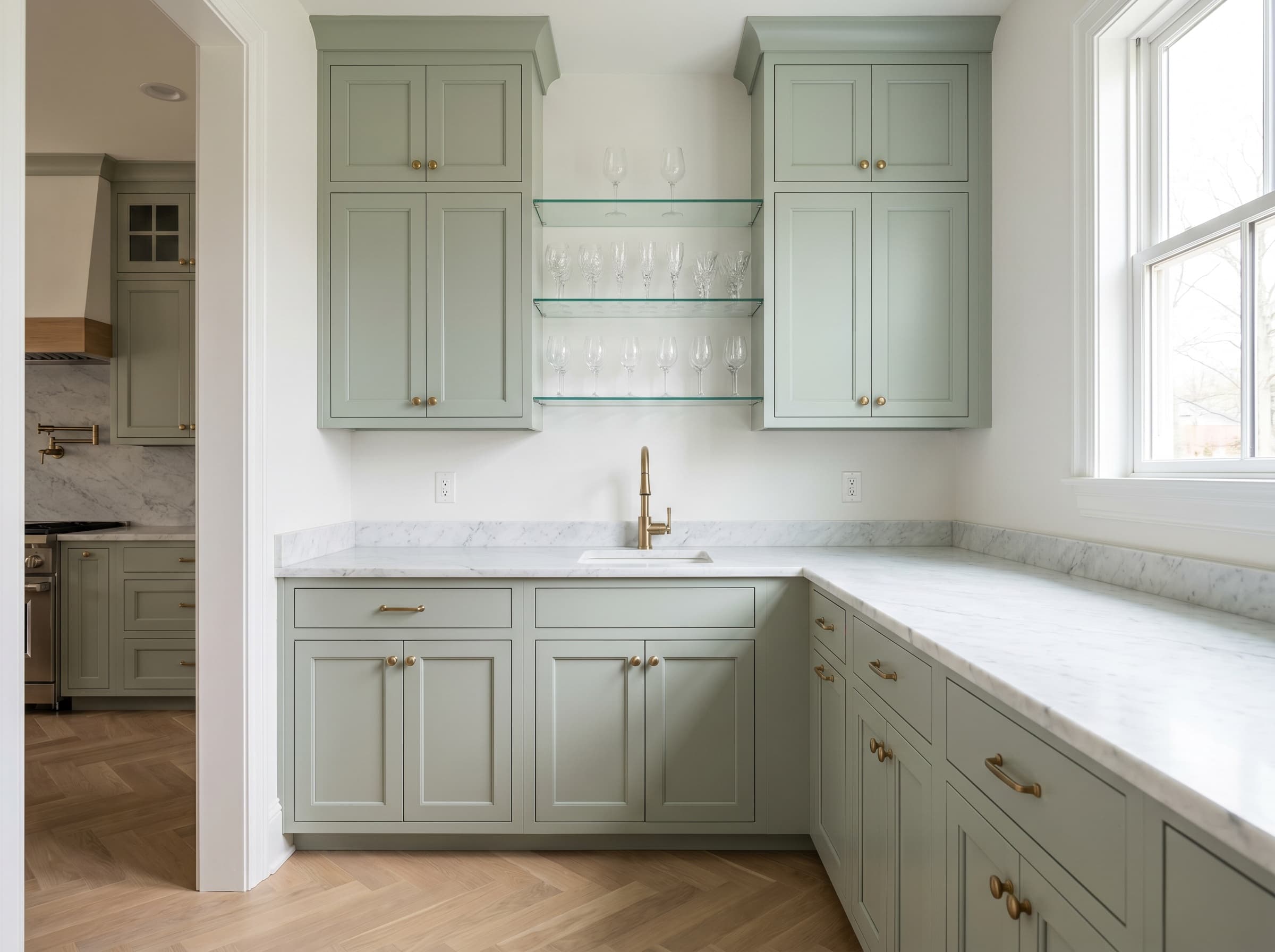 Buford, GA · Sage shaker butler's pantry with marble counter.