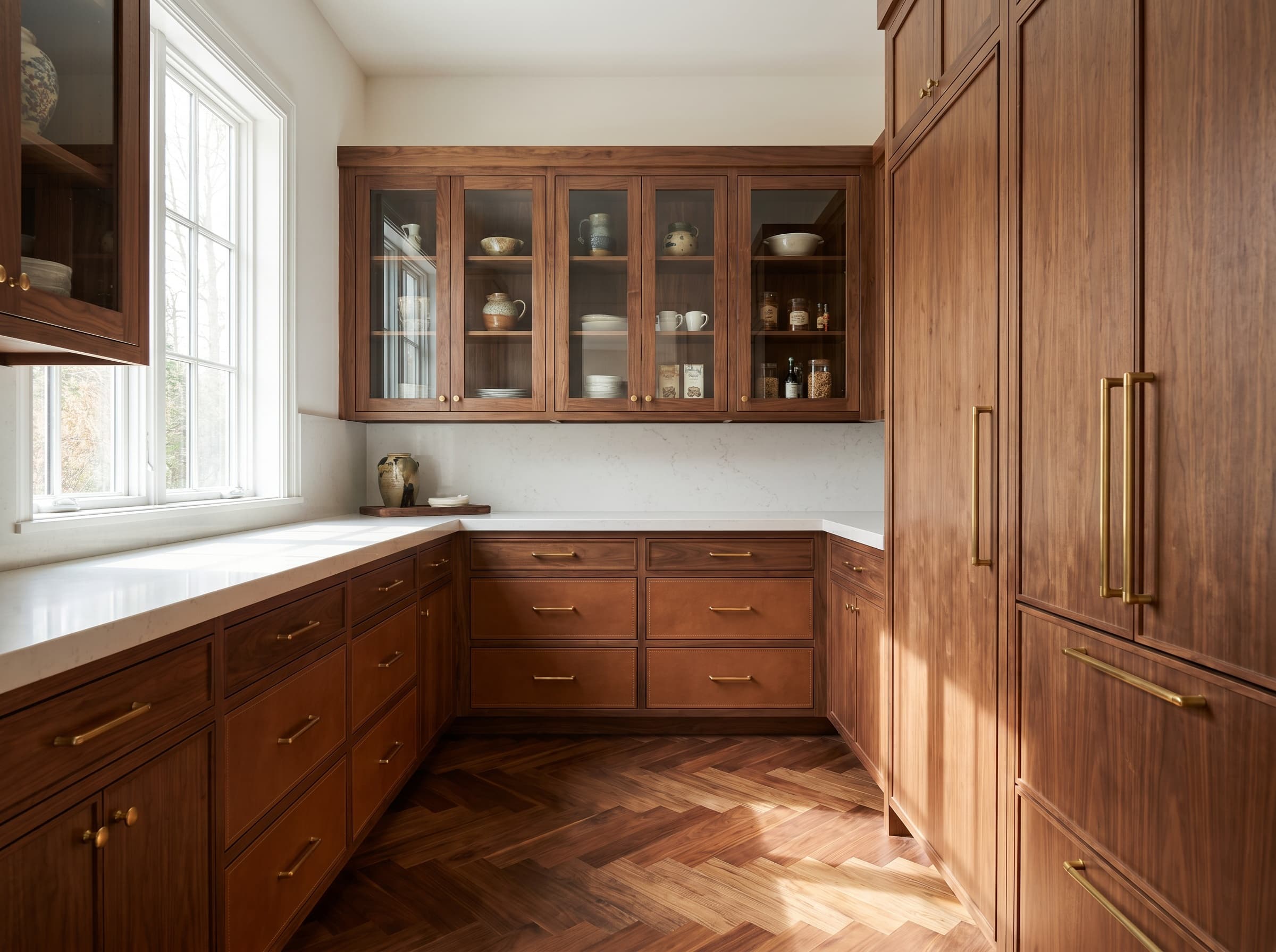 Decatur, GA · Luxury walnut walk-in with leather-front drawers.