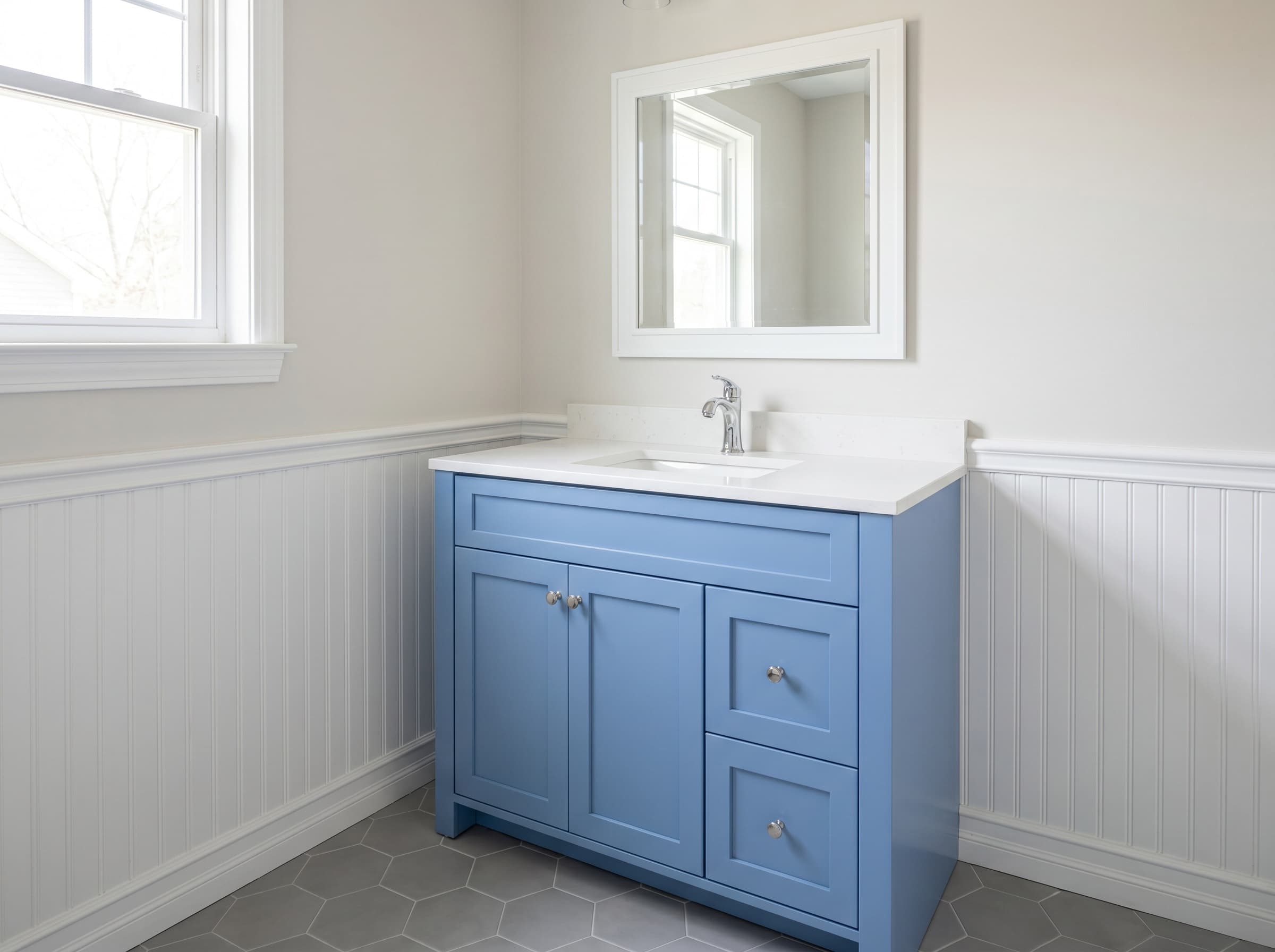 Lawrenceville, GA · 36" cornflower blue shaker guest vanity, white quartz top.