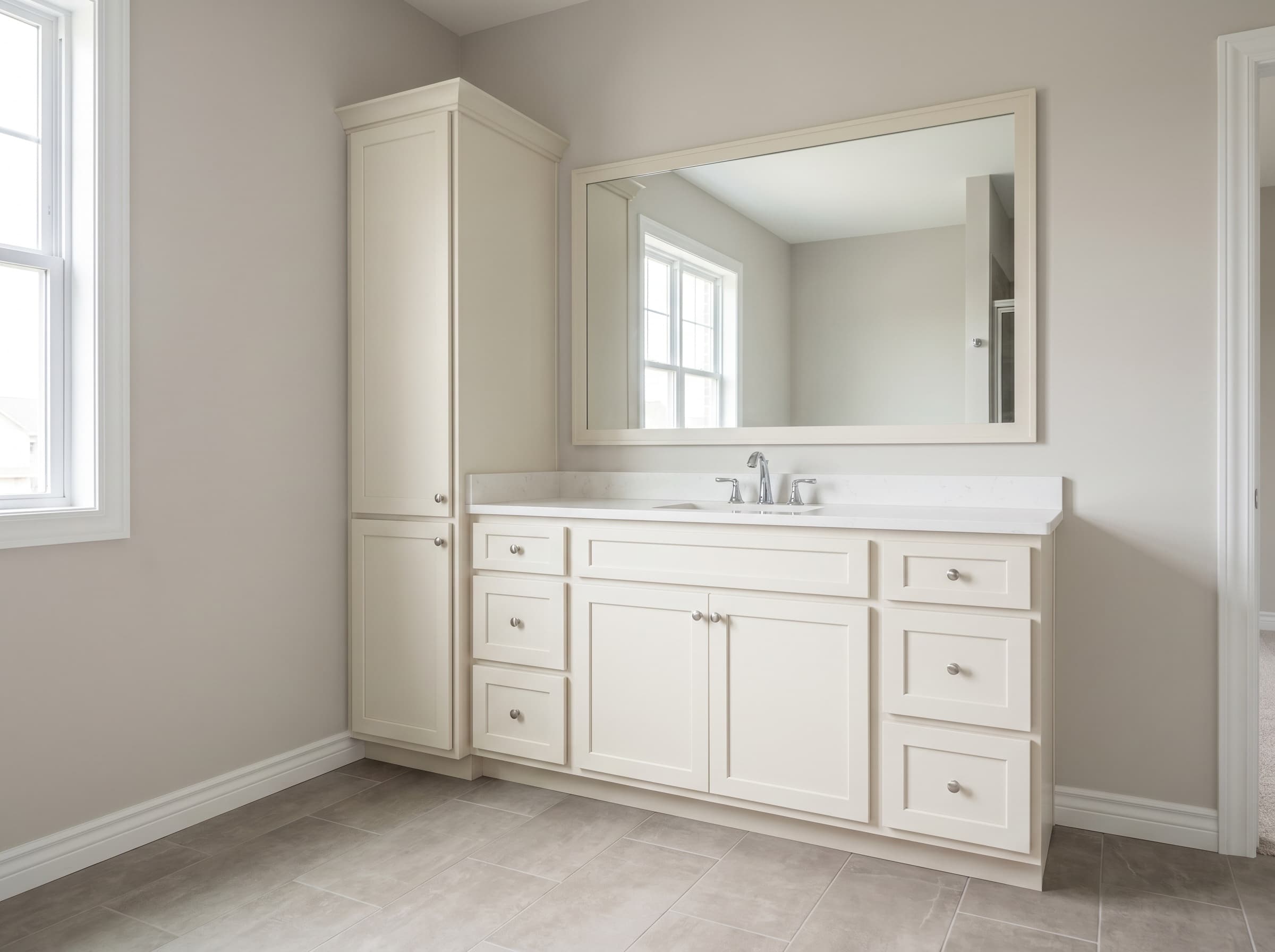 Norcross, GA · 48" cream shaker single paired with a full-height linen tower.