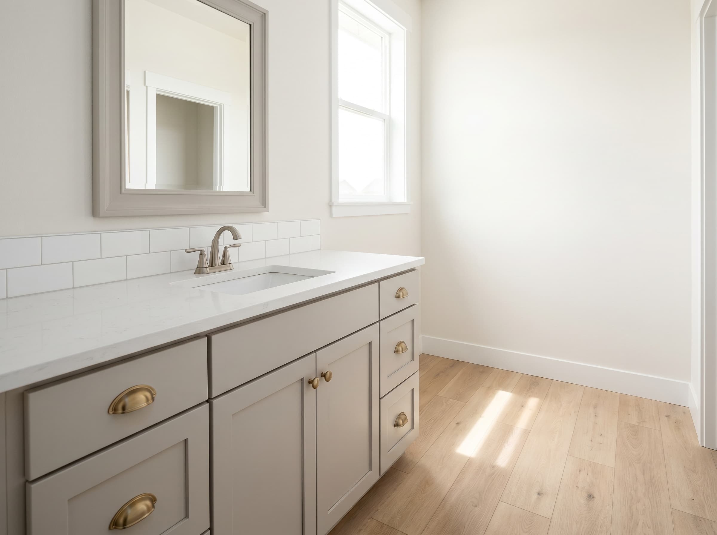 Suwanee, GA · 42" greige shaker single with brushed brass cup pulls.
